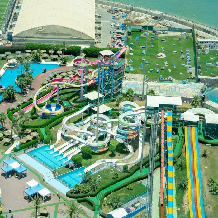 Aerial view of a vibrant waterpark showcasing various water slides, pools, and recreational areas, highlighting the role of solenoid valves like ODE and UNID in regulating water flow for a safe and enjoyable experience.